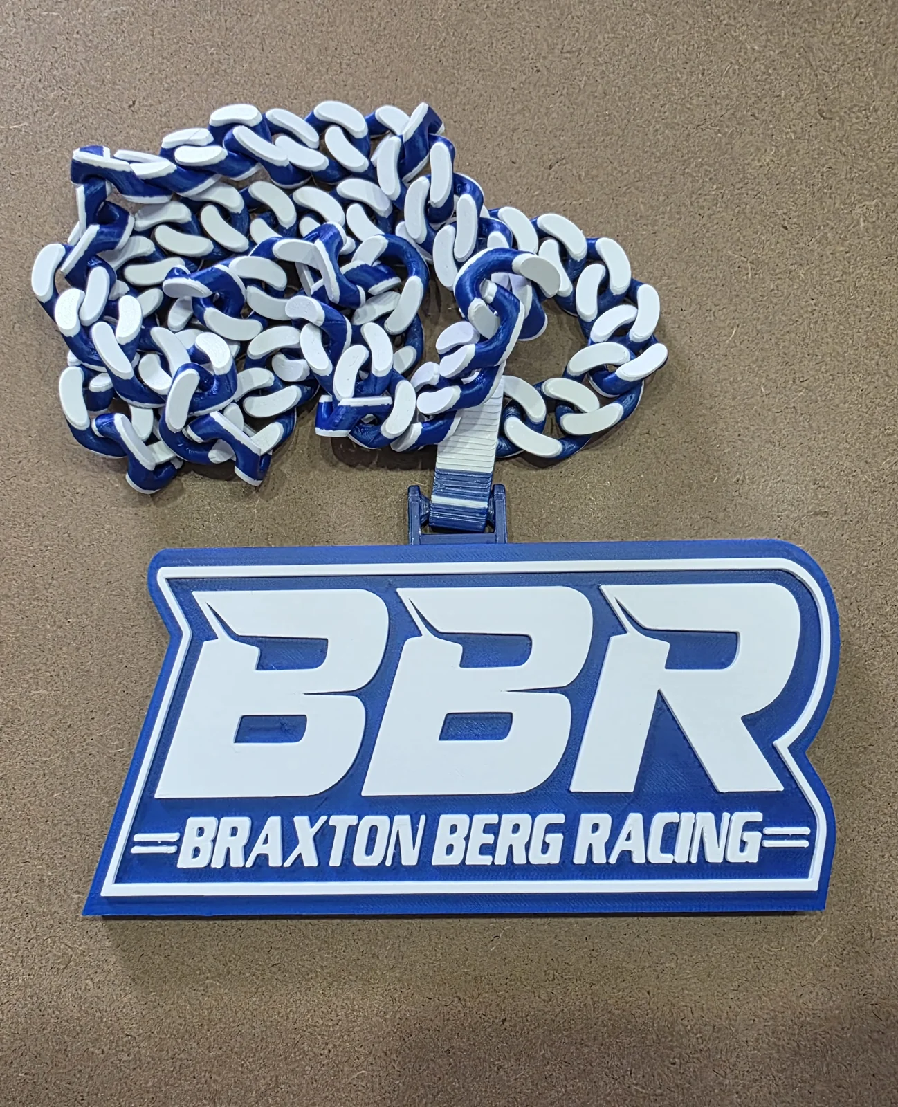 Blue and white BBR Braxton Berg Racing pendant and chain