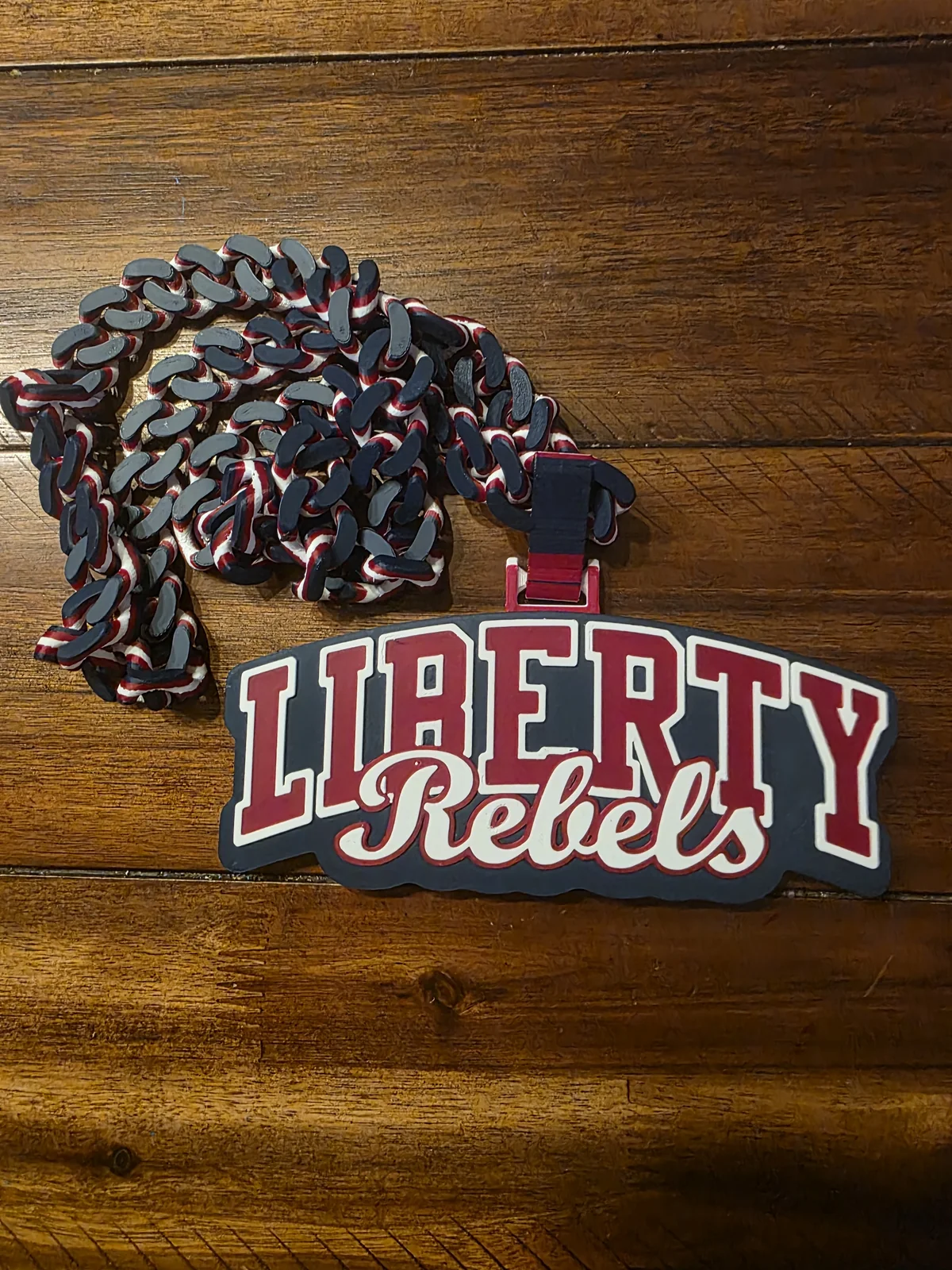 Red white and black Liberty pendant with a dark chain