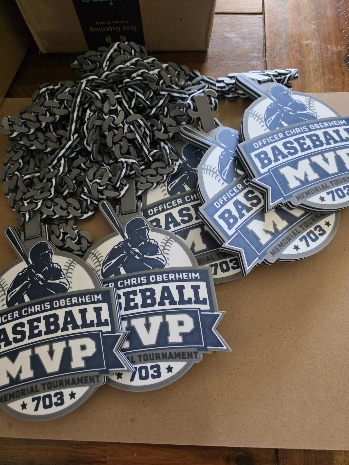Group of Oberheim baseball MVP pendants and dark chains