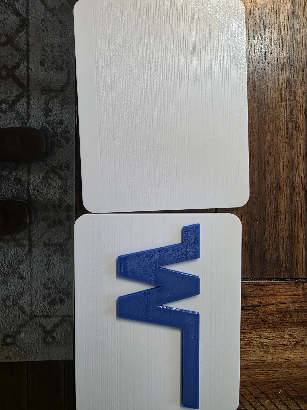 White custom cover with a raised blue W